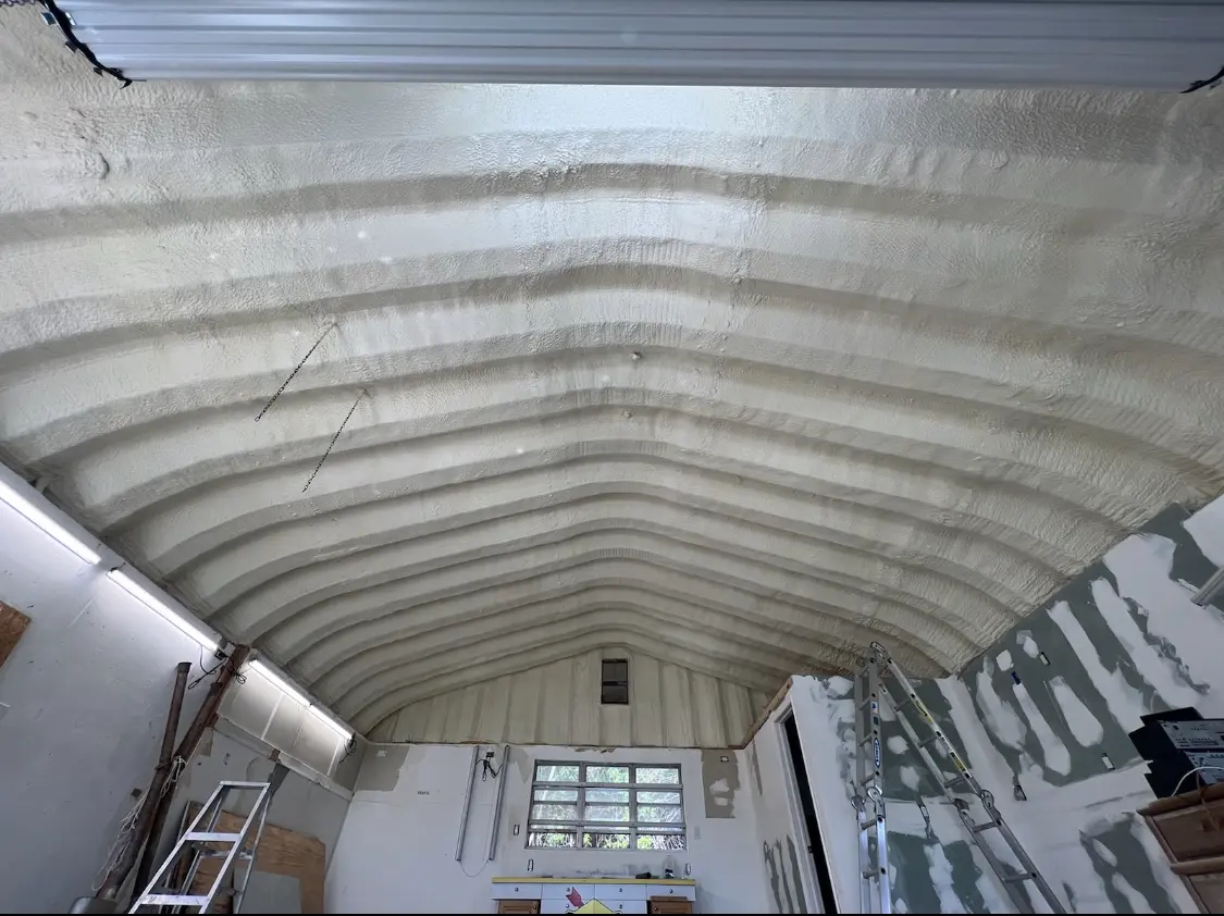 Spray polyurethane foam applied to the underside of a metal roof deck in Sterling Heights